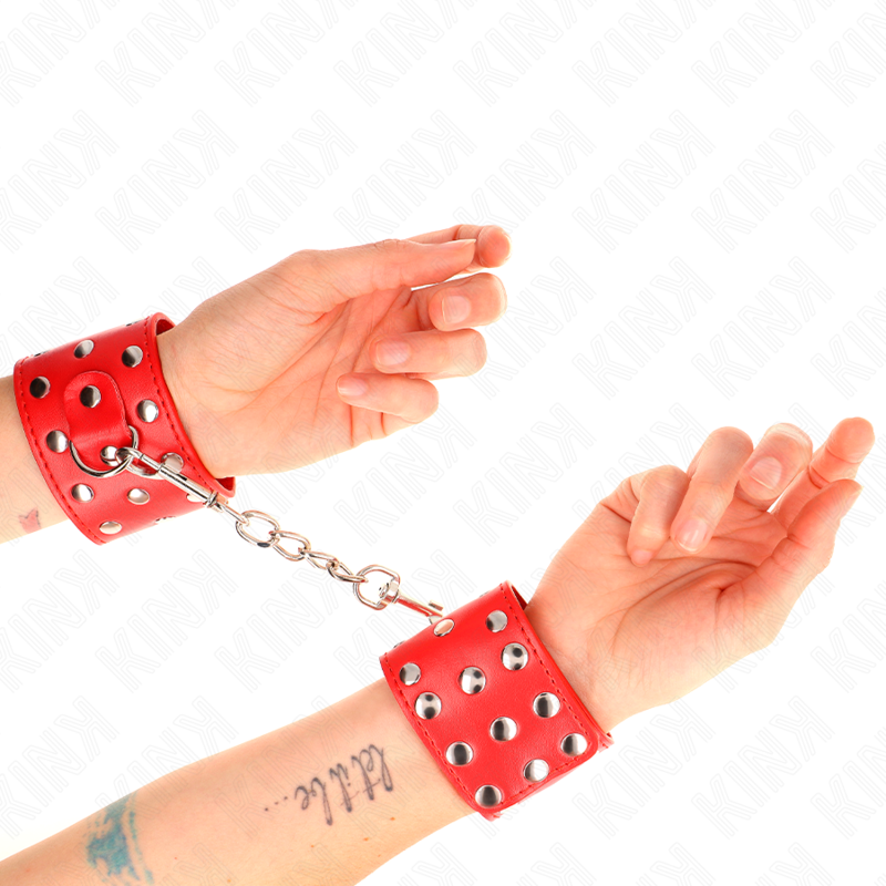 KINK - MENOTTES AVEC BOUCLE À PRESSION REMPLIES DE RIVETS ROUGE RÉGLABLE 19-24 CM X 5,5 CM