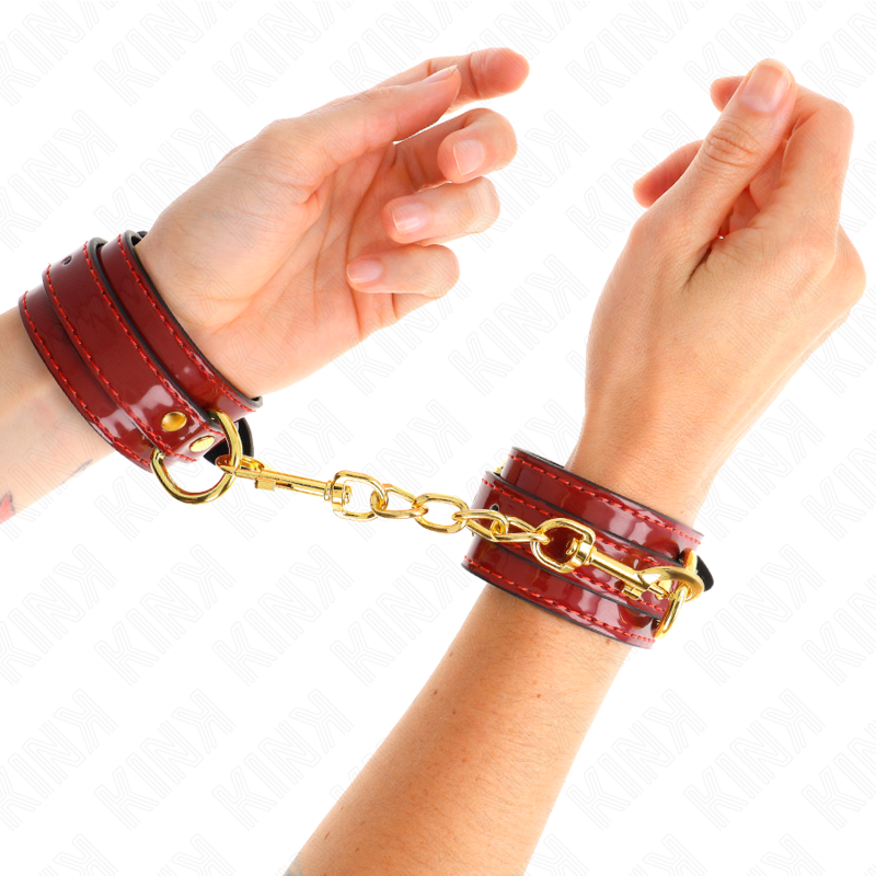 KINK - MENOTTES DE POIGNET JOANNA ANGEL ROUGES RÉGLABLES AVEC CHAÎNE DORÉE 16,5-26 CM X 4 CM